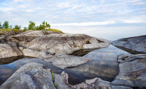 Strait on lake in granite stones stock photo
