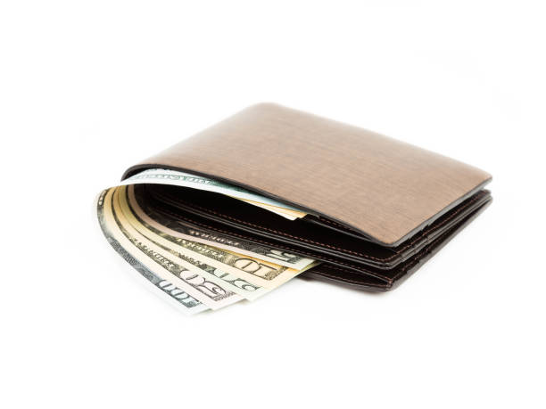 istock Money in brown leather wallet on white background 1061169870