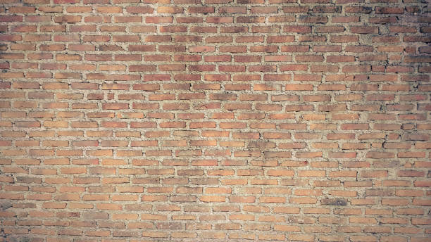 istock old orange vintage brick wall 1061170112