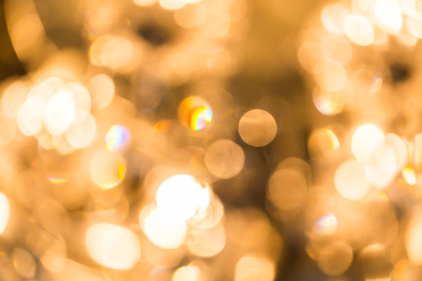 istock Blur Golden bokeh from beautiful crystal chandelier 1061170140