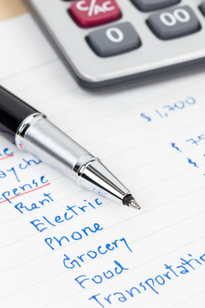 istock Hand writing home budget with calculator 1061172758