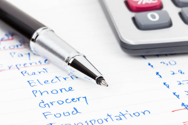 istock Hand writing home budget with calculator 1061172778