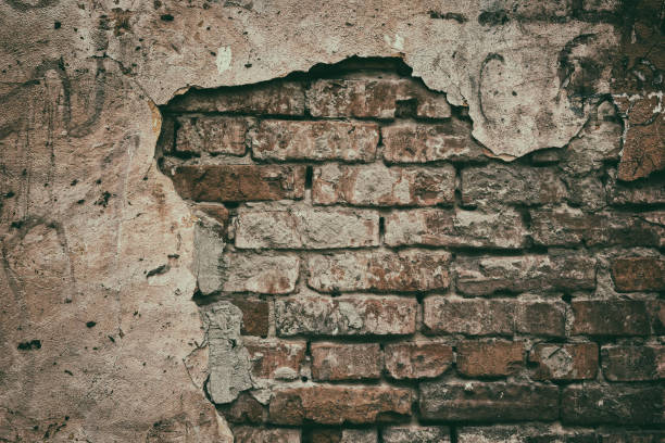 istock Faded retro grunge background of old weathered red brick wall 1061173166