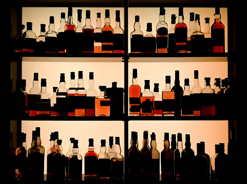 Various bottles of alcohol displayed in a pub.