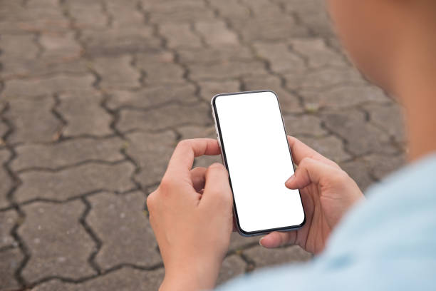 istock Hand's young hipster woman using smart phone on brick road 1061179612