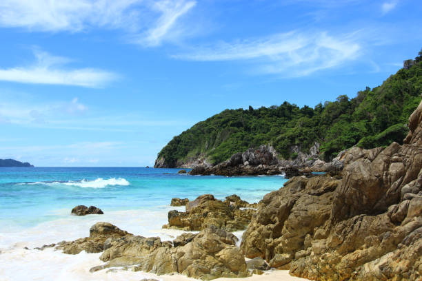 istock The blue sea and sky with mountain and rock 1061179628