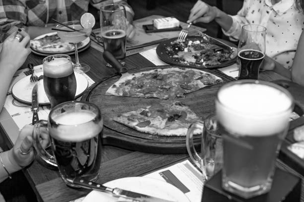 Thanksgiving Day. Friendly dinner in pub or cafe. Beer, pizza and various snacks