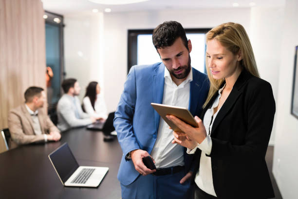 istock Attractive business couple using tablet in their company 1061194016