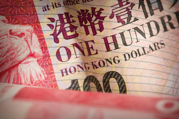 Hong Kong 100 Dollar Banknote Detail Close-up detail shot of a Hong Kong Dollar banknote, showing the text: "One Hundred Hong Kong Dollars". hong kong currency symbol stock pictures, royalty-free photos & images