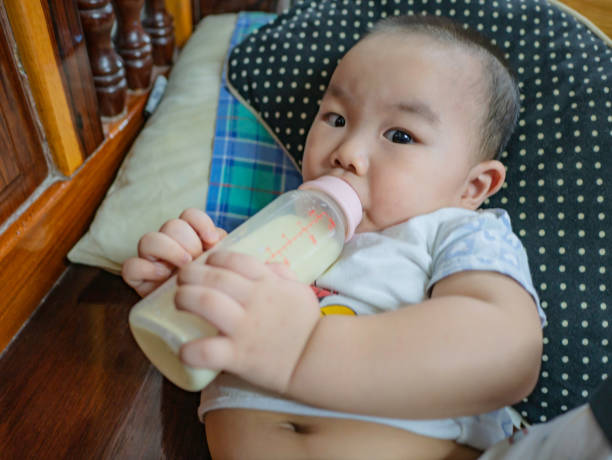 istock Asian baby feeding milk 1061195994