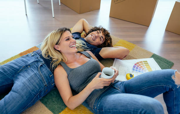 Couple resting lying on the carpet