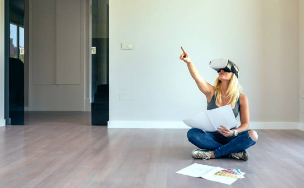 istock Woman watching with virtual reality glasses 1061198484