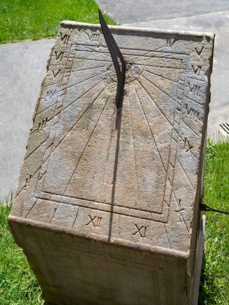 Ancient stone sundial, outdoor, close up Old stone sundial with roman numeral , outdoor, close up ancient sundial stock pictures, royalty-free photos & images