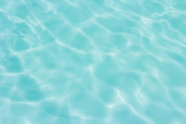 istock Blue swimming pool with sunny reflections 1061202524