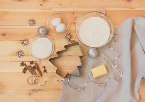 istock Cookie cutter in shape of christmas tree surrounded by baking ingredients 1061203982