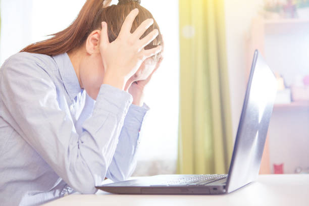 istock Headache at work concept, stressed businesswoman feeling strong migraine working on computer at workplace 1061205148