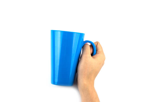 istock Woman Hand with blue cup of tea isolated 1061207772