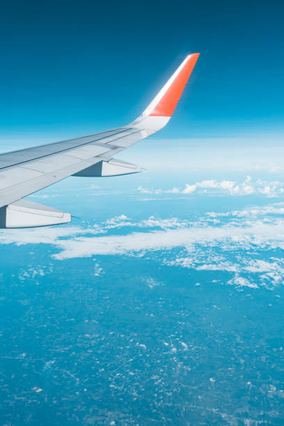 istock Beautiful view from airplane window and blue sky on nice sunny day, This time in altitude during flight. 1061208050