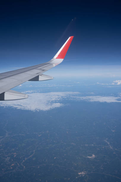 istock Beautiful view from airplane window and blue sky on nice sunny day, This time in altitude during flight. 1061208142
