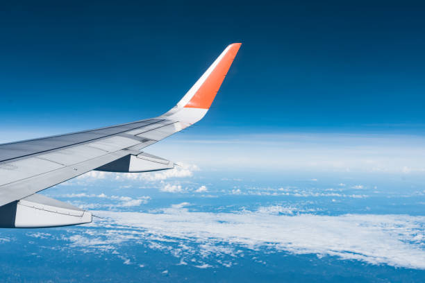 istock Beautiful view from airplane window and blue sky on nice sunny day, This time in altitude during flight. 1061208176