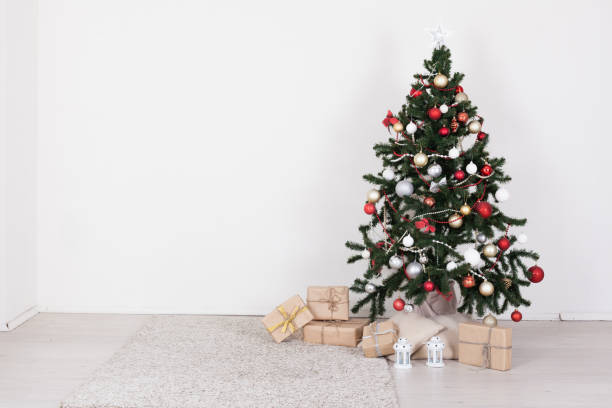istock Christmas tree in white interior with toy decor 1061220022