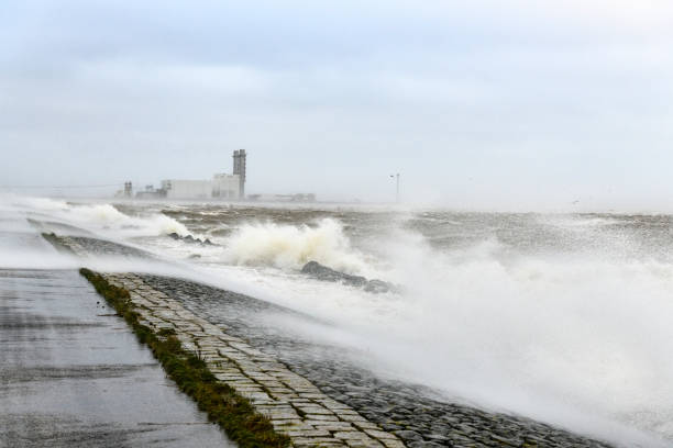 istock Off shore power station in a storm with big waves hitting the shore 1061221108