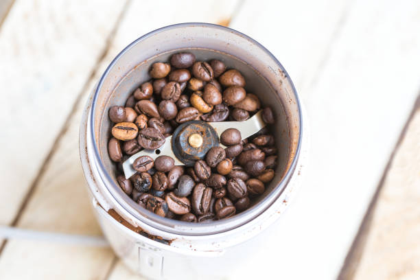 istock Fried coffee beans in a coffee grinder. Macro 1061221216