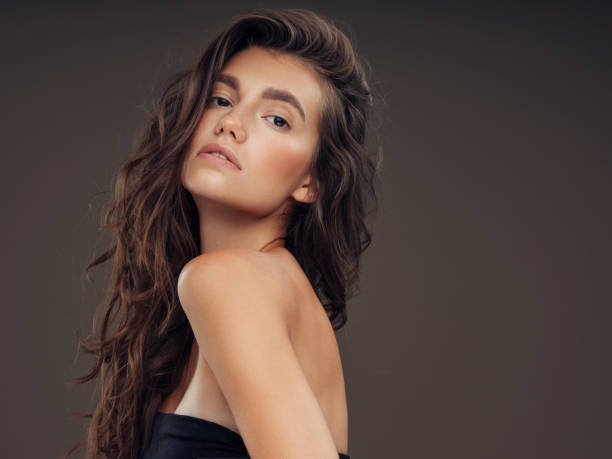 istock Young beautiful model with long wavy well groomed hair 1061221328