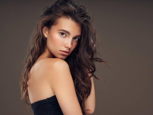 istock Young beautiful model with long wavy well groomed hair 1061221844
