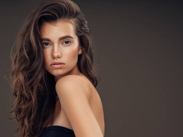 istock Young beautiful model with long wavy well groomed hair 1061221886