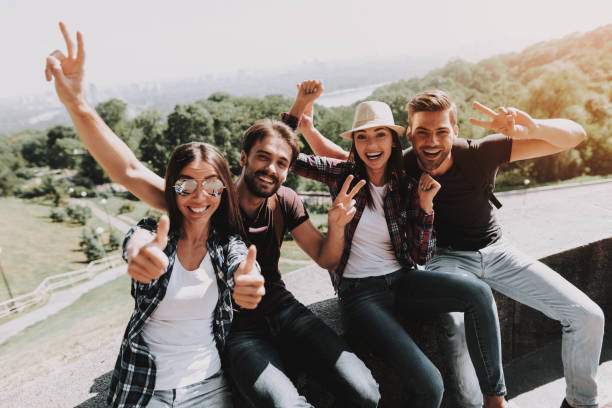 istock Excited Young People with Backpacks in Park 1061230284