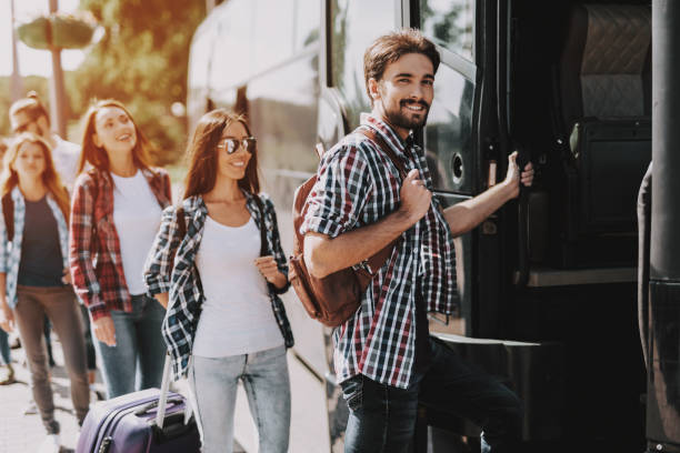 Group of Young People Boarding on Travel Bus