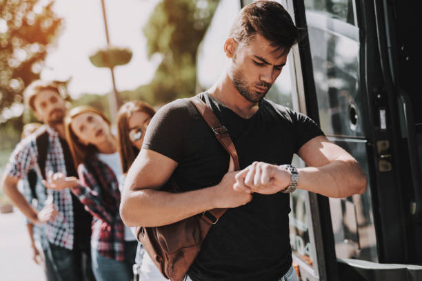 istock Group of Young People Boarding on Travel Bus 1061230414