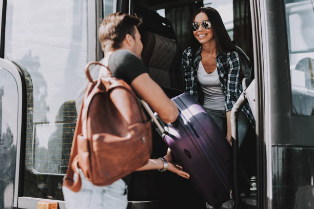 istock Smiling Young couple Boarding on Travel Bus 1061230432