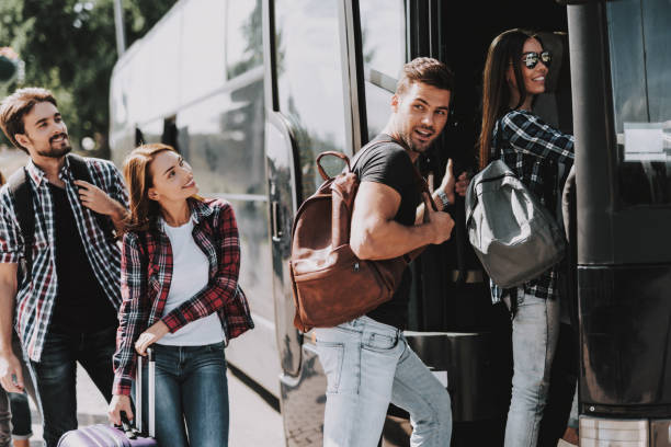 istock Group of Young People Boarding on Travel Bus 1061230436