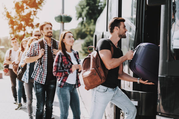 istock Group of Young People Boarding on Travel Bus 1061230438
