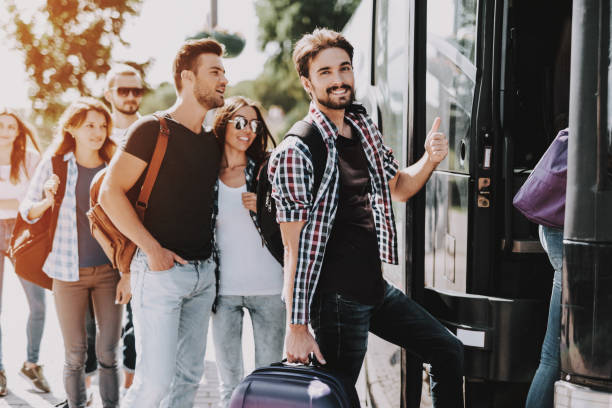 istock Group of Young People Boarding on Travel Bus 1061230458