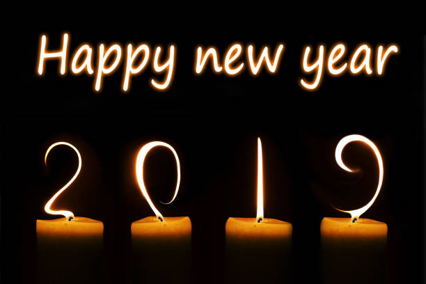 istock 2019 written with candle flames on black background 1061231834