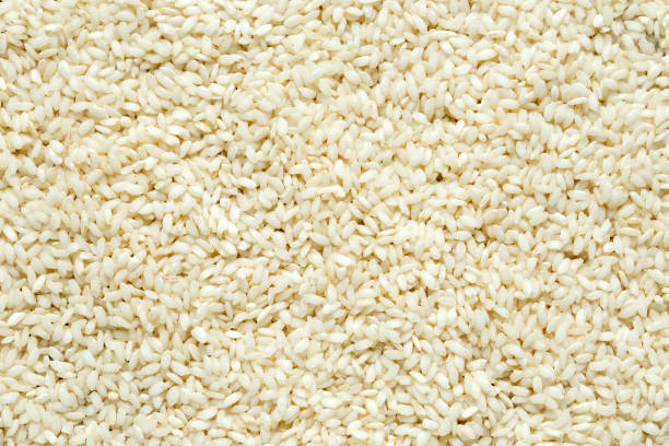 istock Raw arabic rice white closeup, background, texture. 1061233288