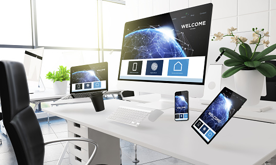 3d rendering mockup of computers, mobile devices and assorted office supplies floating  in mid-air at office showing landing page. Some elements furnished by NASA.