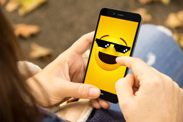 istock woman with meme phone in the park 1061234636