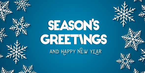 Season's Greetings and Happy New Year greeting card concept with white snowflakes and blue background