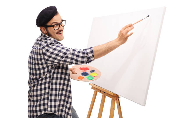istock Happy man painting on a canvas 1061244688