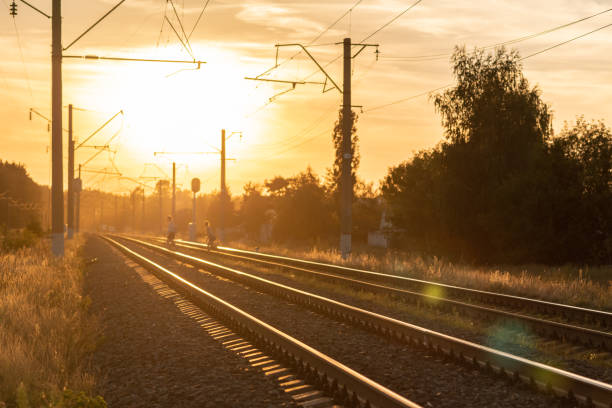 istock Railway at sunset without train. Beautiful perspective view to railroad. 1061249814