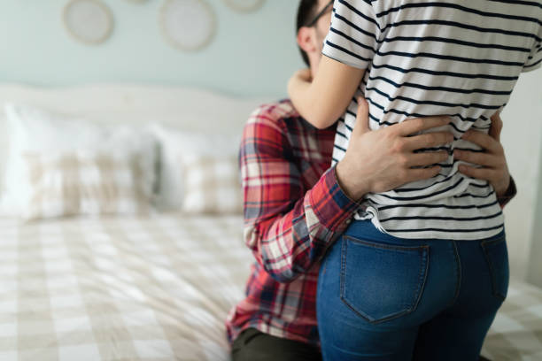 istock Young attractive couple having romantic time in bed 1061253454