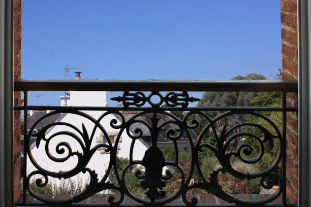 istock Retro style window Exterior view Wrought iron balcony 1061253580