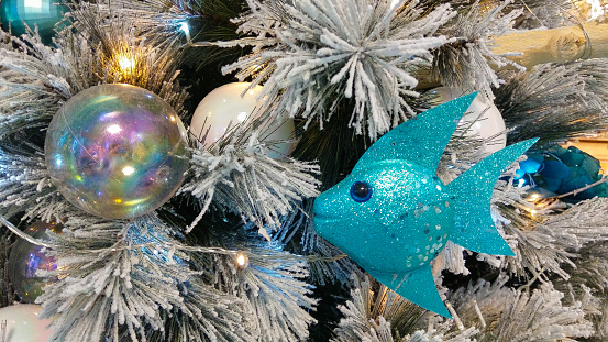 Close up of blue fish on christmas tree