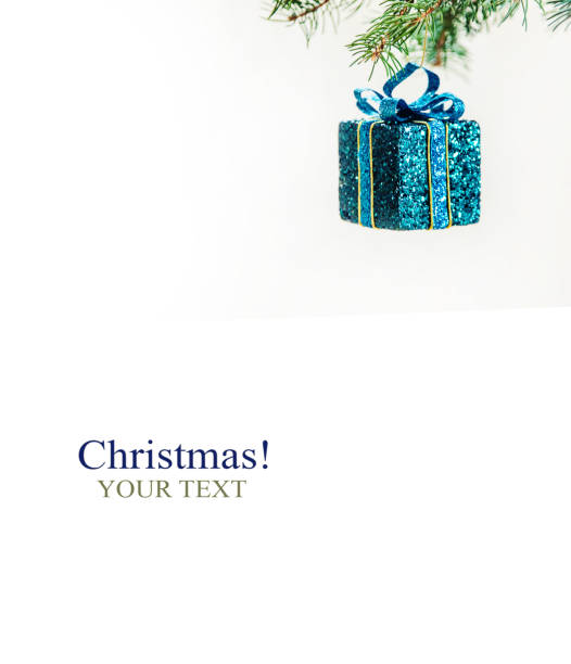 Christmas card. Two beautiful, blue and silver gift boxes with ribbon, three baubles arranged on a light blue background. Copy space, studio shot.