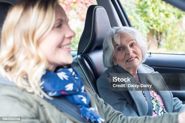 Female Neighbor Giving Senior Woman A Lift In Car Stock Photo - Download Image Now - Senior Adult, Car, Driving