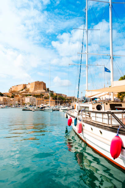 a view of Bonifacio, in Corse, France a view over the Mediterranean sea at the port of Bonifacio, in Corse, France, with its famous citadel in the background on the top of a promontory bonifacio stock pictures, royalty-free photos & images